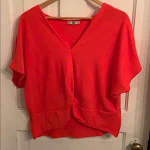 Reddish-orange blouse